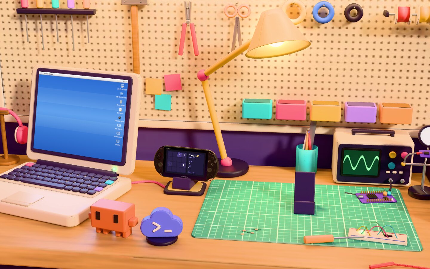 The laptop, a docked handheld, and two small figures of the coding agents on the workbench.